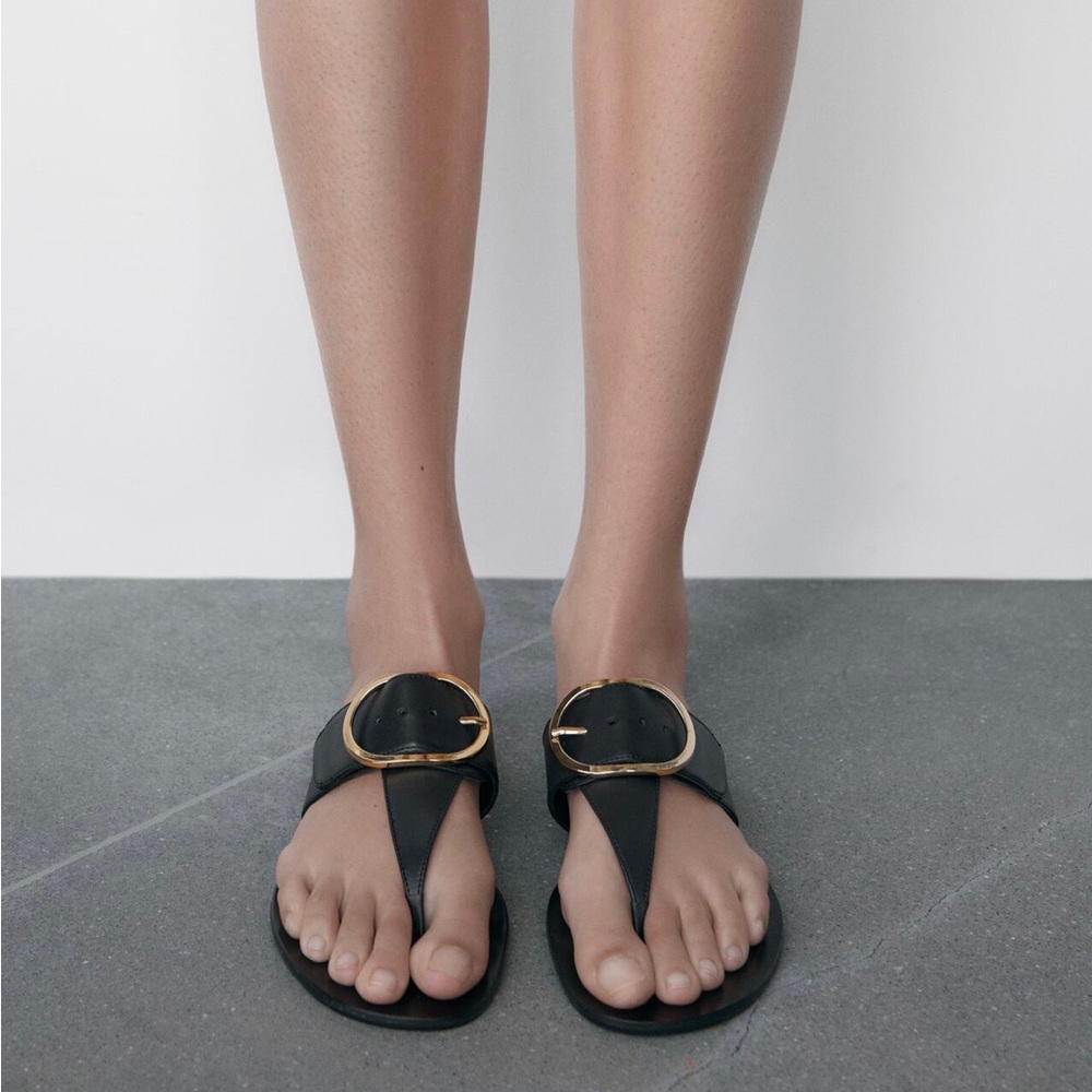 Zara black leather thong sandals with thin gold oval buckle